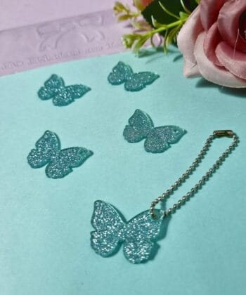 Pingente Acrílico Borboleta Verde Água Glitter- 5un
